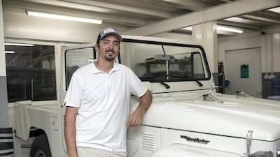 Sebsports founder Sebastian Husseini with one of Land Cruisers currently being worked on at his workshop. Antonie Robertson / The National