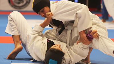 Shaikha Al Mansouri of the UAE grapples with Hajer Al Meqbaali (on top) of the UAE in the Abu Dhabi World Youth Jiu-Jitsu Championship 2016. Ravindranath / The National