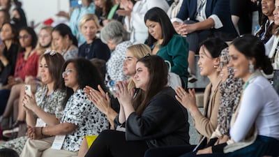 The audience listens to the speakers at the summit.