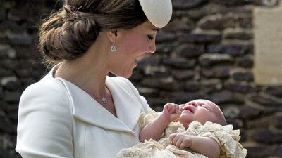 Catherine, Duchess of Cambridge, carries Princess Charlotte as they arrive at the Church of St Mary Magdalene for the christening of Princess Charlotte of Cambridge on July 5, 2015 in King's Lynn, England. Getty Images