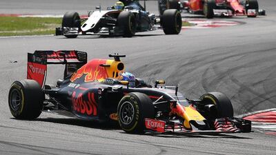 Red Bull Racing's Australian driver Daniel Ricciardo takes a corner during the Formula One Malaysian Grand Prix in Sepang on October 2, 2016. Manan Vatsyayana / AFP