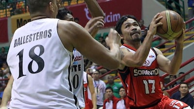 Manny Pacquiao shown driving to the basket during a Philippines Basketball Association game last year with his Kia Sorento team. Mike Young for The National / October 4, 2014