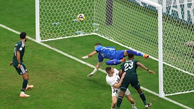 Saudi Arabia's Mohamed Kanno scores the second goal past Palestine's Ikram Rami Hamadeh. Reuters