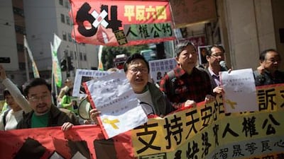 Protesters march towards the China Liaison Office of the People's Republic of China during a demonstration in Hong Kong,during the Communist Party's policy address on Tuesday. Jerome Favre / EPA