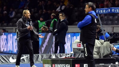 Hertha Berlin's former manager Jurgen Klinsmann, left, during a Bundesliga match against Schalke. EPA