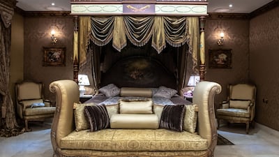 A hand-carved pillar bed in the master bedroom.