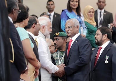 Indian Prime Minister Narendra Modi, centre left, congratulates Maldives President Ibrahim Mohamed Solih after his swearing-in ceremony in Male, Maldives, in 2018. AP Photo