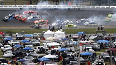 The first crash of the race after just 14 laps. AFP