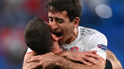 Forward Mikel Oyarzabal and goalkeeper Unai Simon celebrate Spain's quarter-final triumph. AFP
