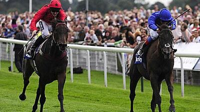 Frankie Dettori, right, on Blue Bunting, beats Vita Nova, ridden by Tom Queally, in the Darley Yorkshire Oaks. The Italian, who rides for Godolphin, has been told to adhere to the new whip law, while the decision on whether Vita Nova will race will be made today.
