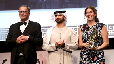 Director Annemarie Jacir (R) with the Muhr Best Fiction Feature award for Wajib with actor Mohammad Bakri and Sheikh Mansoor bin Mohammed bin Rashid Al Maktoum. Vittorio Zunino Celotto / Getty Images for DIFF