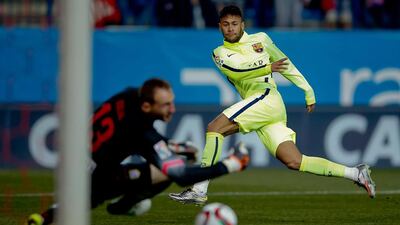 Neymar, right, of Barcelona scores during the Copa del Rey quarter-final second-leg match against Atletico Madrid at Vicente Calderon Stadium on January 28, 2015, in Madrid, Spain. Gonzalo Arroyo Moreno / Getty Images