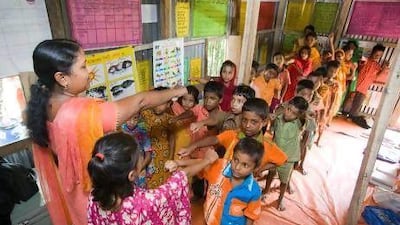 Teacher Mahmuda begins a class at the Shikhon school in Palashpur village.