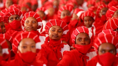 Church members watch the arrival of more than 800 couples taking part in the Easter Sunday mass wedding ceremony, organised by the International Pentecostal Holiness Church Jerusalem City (IPHC), in Kgabalatsane, in the North-West province, South Africa, April 9, 2023. REUTERS / Siphiwe Sibeko TPX IMAGES OF THE DAY