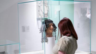 A visitor at the Gateway: Fragments, Yesterday and Today exhibition, curated by Paolo Colombo. Reem Mohammed / The National