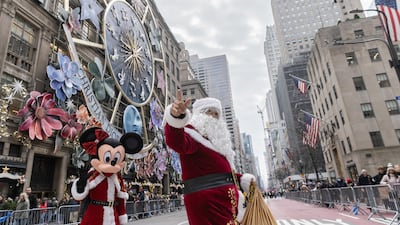 A man dressed as Santa Claus walks on 5th Avenue on Christmas Eve in New York, US. Reuters