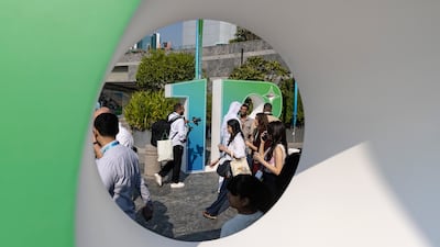 Visitors and delegates arrive at the 1 Billion Followers Summit in Dubai. Antonie Robertson / The National