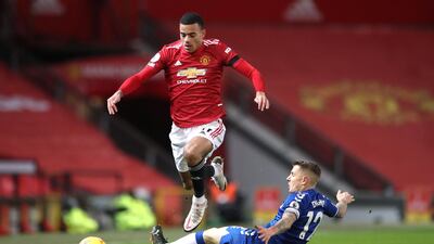 United's Mason Greenwood skips over a challenge from Lucas Digne of Everton. PA