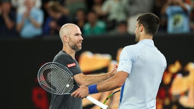 Novak Djokovic shakes hands with Adrian Mannarino after their match at the Australian Open. AFP