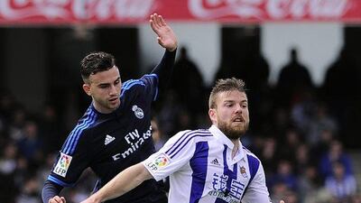 Real Madrid’s midfielder Borja Mayoral (L) vies with Real Sociedad’s midfielder Asier Illarramendi during the La Liga match between Real Sociedad and Real Real Madrid CF at the Anoeta stadium in San Sebastian on April 30, 2016. AFP / ANDER GILLENEA