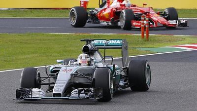 Lewis Hamilton leads Ferrari's Sebastian Vettel during the Japanese Grand Prix. Shizuo Kambayashi / AP Photo