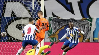 Porto's Moussa Marega, right, celebrates with Mehdi Taremi, left, after scoring his side's second goal during the Champions League. AP