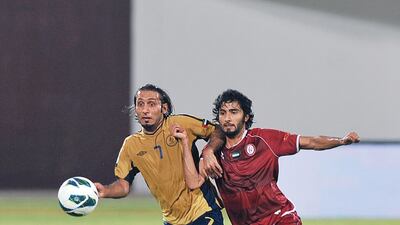 Richard Porta of Dubai fights for the ball with Al Wahda's Salem Saleh. Azeem Shaukat / Al Ittihad