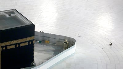 A Saudi policeman prays in front of the Kaaba, the cubic building at the Grand Mosque, in the Muslim holy city of Mecca, Saudi Arabia. AP Photo