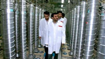 Iranian President Mahmoud Ahmadinejad, centre, visits the Natanz Uranium Enrichment Facility 322km south of the capital Tehran, Iran. Ahmadinejad announced major progress in Iran's push for nuclear power,