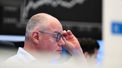 A trader at the Frankfurt Stock Exchange watches as global markets react to US tariffs. AP