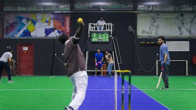 A group of men play indoor cricket at the Insportz Club in the Al Quoz area of Dubai. Christopher Pike / The National