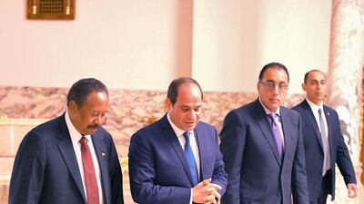 Mr Hamdok walks with Egyptian President, Abdel Fattah El Sisi during their meeting at the Al Ittihadiyah Palace in Cairo in Septemper. Getty