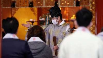 A Shinto priest prepares for a ceremony for companies wishing for prosperous business on the first business day of the new year at the Kanda Myojin shrine in Tokyo, Japan. Reuters