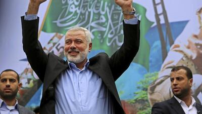 Palestinian top Hamas leader Ismail Haniyeh greets supporters during a rally to commemorate the 27th anniversary of the Hamas militant group, at the main road in Jebaliya in the northern Gaza Strip. (AP Photo/Adel Hana, File)
