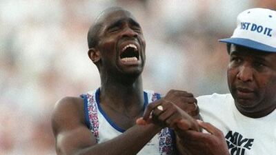 Derek Redmond, the British athlete, is helped by his father after tearing a hamstring during the 400-metre semi-final at the 1992 Barcelona Olympics which left him in tears, but determined to finish.
