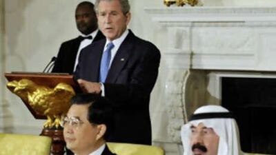 George W Bush urged leaders of the world's biggest economies not to abandon free-market capitalism as they seek an escape from the financial crisis.