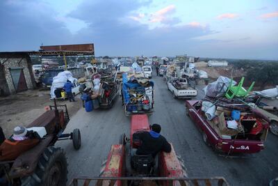 Civilians flee a Syrian military offensive in Idlib province near Hazano, Syria, December 24, 2019. AP