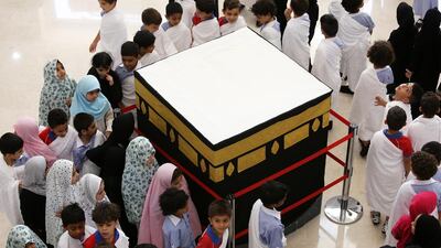 On the eve of the real thing, 600 children from a primary school in Dubai took part with their parents in an educational ‘mini haj’, with a replica of the Kaaba, three posts standing in for the Jamarat and a carpet representing Mount Arafat. Pawan Singh / The National