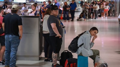 Travellers wait at Detroit airport amid the disruption caused by the global IT outage. The aviation industry was hit hard by the incident. Getty Images