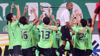 South Korea's Jeonbuk Hyundai Motors players celebrate a goal of midfielder Leonardo against South Korea's FC Seoul during their semi-final first leg of the Asian Champions League in Jeonju on September 28, 2016. AFP