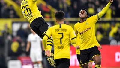 Dortmund's Lukasz Piszczek, left, celebrates with Dan-Axel Zagadou after scoring the opening goal. AP