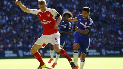 Arsenal's Per Mertesacker, left, in action against Chelsea's Radamel Falcao during the FA Community Shield at Wembley Stadium on August 2, 2015. Reuters / Darren Staples