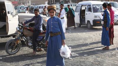 In this Friday, Feb. 2, 2018, photograph, a young Yemeni man leaves a shop in Marib, Yemen. Yemen's conflict, which began as a civil war in 2014 and escalated into a regional proxy fight, drags on today. Winning the hardscrabble terrain takes time and costs dearly, only exacerbating the country's humanitarian crises and making a war that's seen over 10,000 people killed last that much longer. (AP Photo/Jon Gambrell)