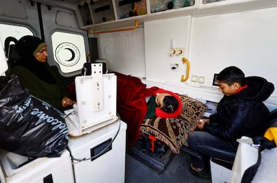 An ambulance carries a patient and his relatives back to their homes after Israel stopped medical evacuations through the Rafah crossing on February 4. Reuters