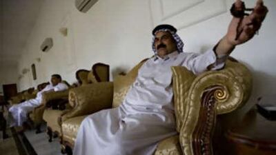 Sheikh Hasan al Hamadani, front, and Mizher al Hamadani, the architects of the sahwa council movement, in their house in Mahmudiyah.