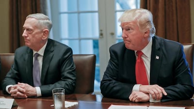 President Donald Trump, right, listens during a briefing with senior military leaders in the Cabinet Room of the White House in Washington, as Defense Secretary Jim Mattis watches. Pablo Martinez Monsivais/ AP Photo