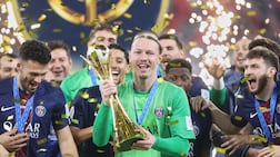PSG's goalkeeper Matvey Safonov holds the trophy after winning the FIFA Intercontinental Cup final soccer match between Flamengo and Paris Saint-Germain in Doha, Qatar, Wednesday, Dec. 17, 2025. (AP Photo / Hussein Sayed)