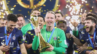 PSG's goalkeeper Matvey Safonov holds the trophy after winning the FIFA Intercontinental Cup final soccer match between Flamengo and Paris Saint-Germain in Doha, Qatar, Wednesday, Dec. 17, 2025. (AP Photo / Hussein Sayed)