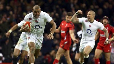 Jonathan Joseph of England runs through for a try to make it 16-13 Wales at the time in his side's eventual Six Nations victory on Friday. Geoff Caddick / EPA