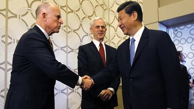 The Chinese vice president Xi Jinping meets the California governor Jerry Brown, left, and the US commerce secretary John Bryson. Robert Gauthier / AFP